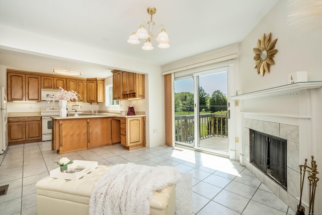 592 Mountain Rd Unit A, West Hartford, CT 06117 - kitchen featuring light tile patterned flooring, a chandelier, white appliances, light countertops, and a sink