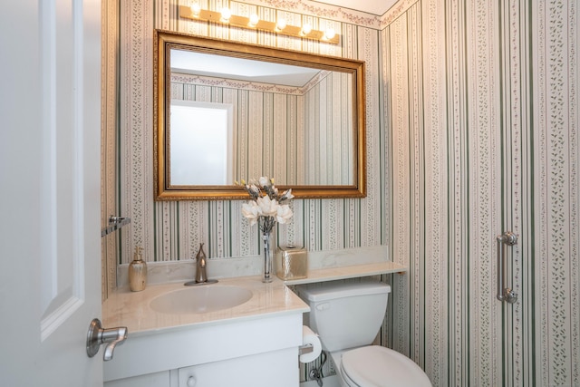 592 Mountain Rd Unit A, West Hartford, CT 06117 - bathroom featuring wallpapered walls, toilet, and vanity