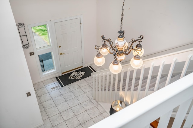 592 Mountain Rd Unit A, West Hartford, CT 06117 - foyer with light tile patterned floors and a chandelier