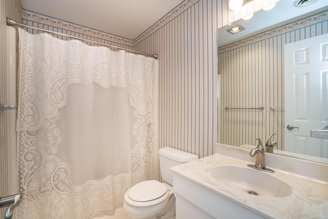592 Mountain Rd Unit A, West Hartford, CT 06117 - bathroom with wallpapered walls, toilet, vanity, and a shower with shower curtain