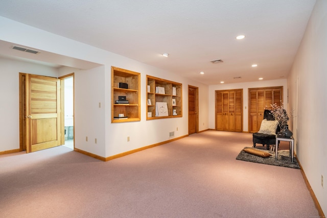 592 Mountain Rd Unit A, West Hartford, CT 06117 - unfurnished room with light colored carpet, baseboards, recessed lighting, and built in shelves