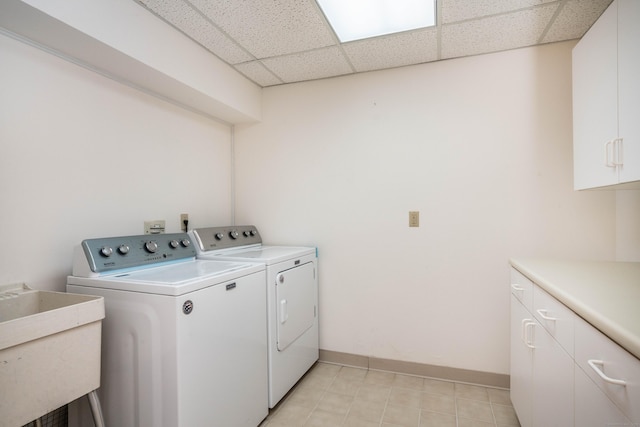 592 Mountain Rd Unit A, West Hartford, CT 06117 - laundry area with cabinet space, independent washer and dryer, baseboards, and light tile patterned floors