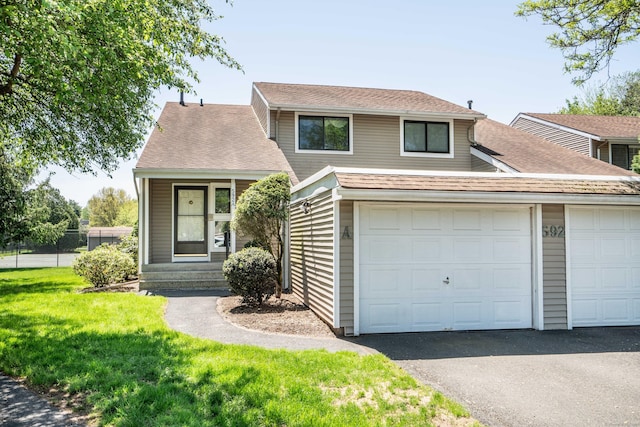 592 Mountain Rd Unit A, West Hartford, CT 06117 - view of front of property with a front lawn, driveway, and roof with shingles
