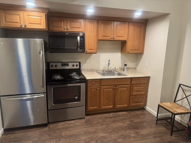 15 Townley St, Hartford, CT 06105 - kitchen with appliances with stainless steel finishes, a sink, dark wood finished floors, light stone countertops, and recessed lighting