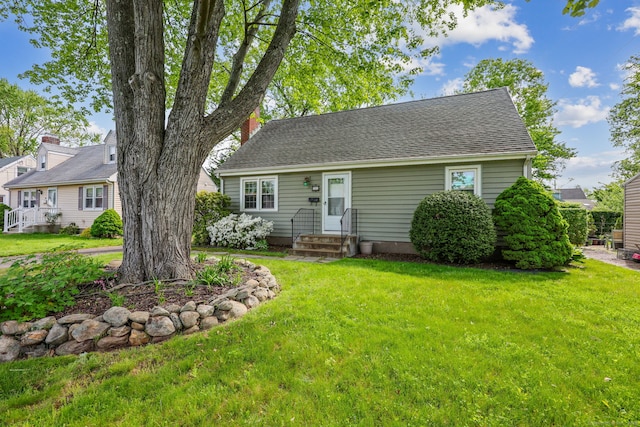 26 Brian Rd, West Hartford, CT 06110 - new england style home featuring a front yard, a shingled roof, and entry steps