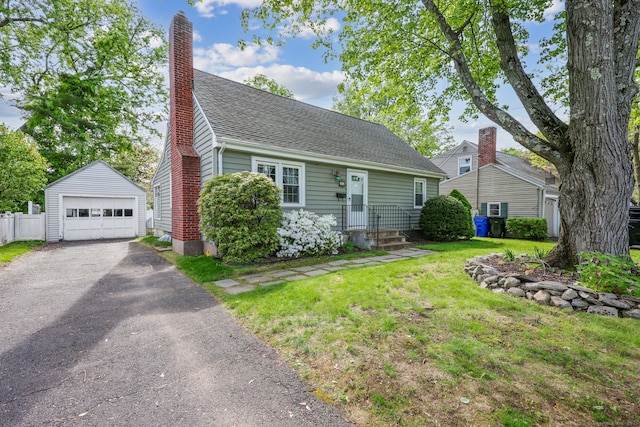 26 Brian Rd, West Hartford, CT 06110 - view of front of property featuring an outdoor structure, a detached garage, asphalt driveway, a chimney, and a shingled roof