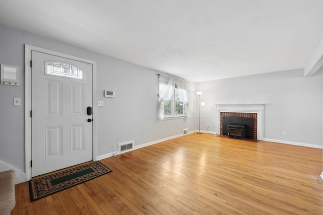 26 Brian Rd, West Hartford, CT 06110 - unfurnished living room featuring healthy amount of natural light, light wood-type flooring, and baseboards
