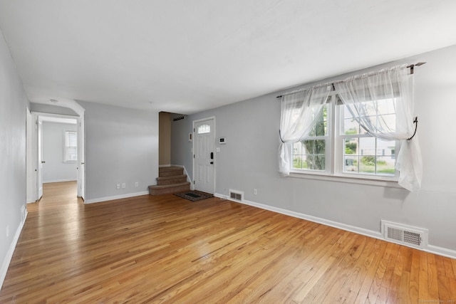 26 Brian Rd, West Hartford, CT 06110 - unfurnished living room featuring light wood-style flooring, baseboards, and stairs