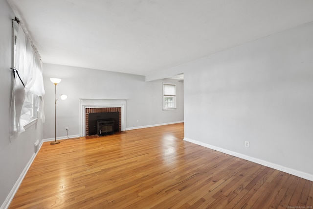 26 Brian Rd, West Hartford, CT 06110 - unfurnished living room with light wood-type flooring and baseboards