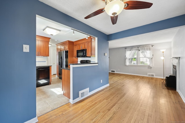 26 Brian Rd, West Hartford, CT 06110 - kitchen featuring black appliances, brown cabinetry, a ceiling fan, and light wood-style flooring