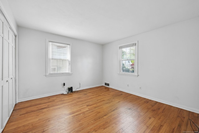 26 Brian Rd, West Hartford, CT 06110 - unfurnished bedroom with a closet, light wood-style floors, and baseboards