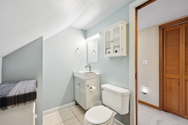 26 Brian Rd, West Hartford, CT 06110 - bathroom with lofted ceiling, vanity, toilet, baseboards, and a closet