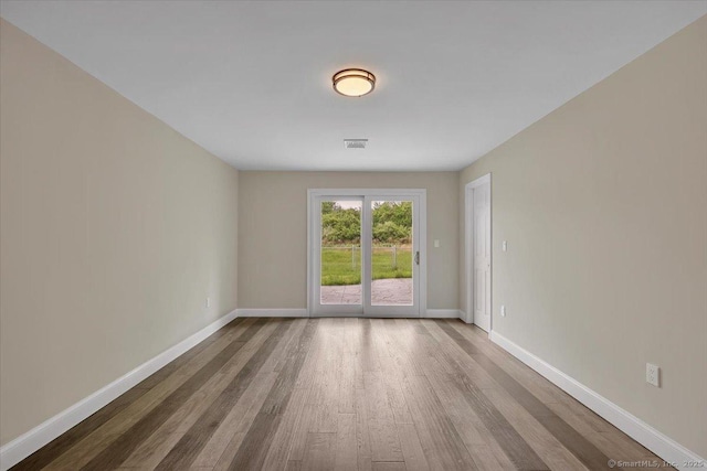 1813 Peck Ln, Cheshire, CT 06410 - empty room featuring wood finished floors and baseboards