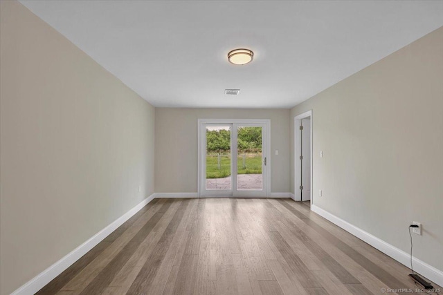 1813 Peck Ln, Cheshire, CT 06410 - empty room featuring wood finished floors and baseboards