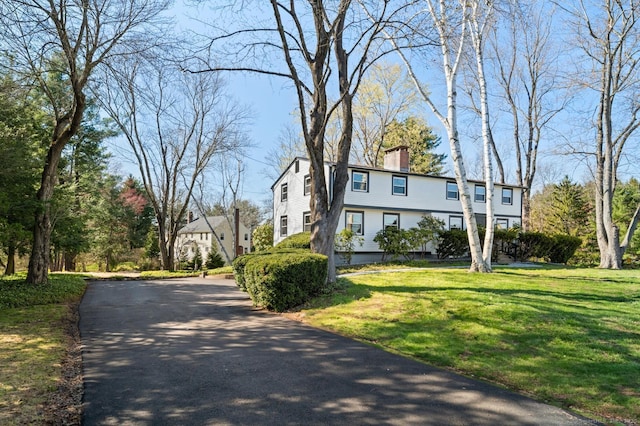 689 S Meriden Rd, Cheshire, CT 06410 - view of front of property featuring a chimney, a front lawn, and driveway
