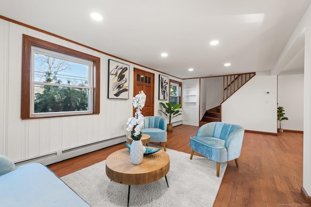 689 S Meriden Rd, Cheshire, CT 06410 - living area with baseboard heating, stairway, wood finished floors, recessed lighting, and a baseboard radiator