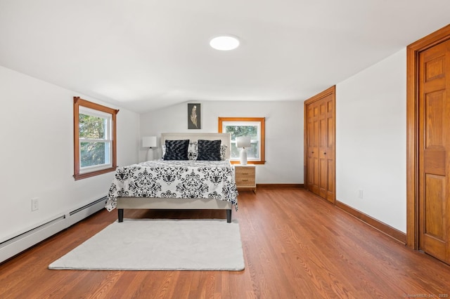 689 S Meriden Rd, Cheshire, CT 06410 - bedroom with a baseboard heating unit, wood finished floors, lofted ceiling, and baseboards