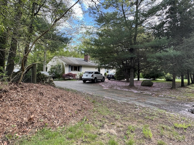 492 Providence New London Tpke, North Stonington, CT 06359 - view of front of property with driveway and a chimney
