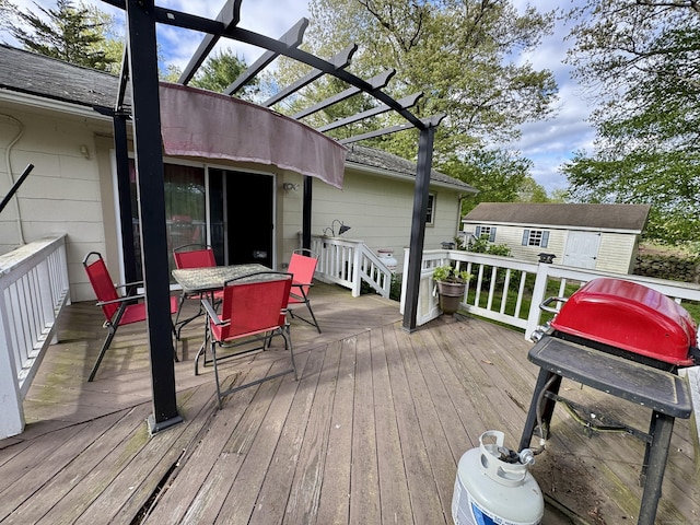 492 Providence New London Tpke, North Stonington, CT 06359 - deck with outdoor dining area, an outbuilding, and a pergola