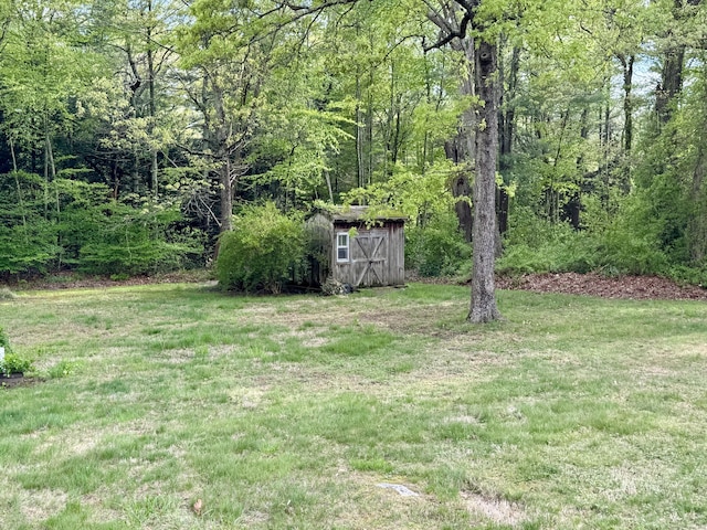 492 Providence New London Tpke, North Stonington, CT 06359 - view of grassy yard featuring a wooded view