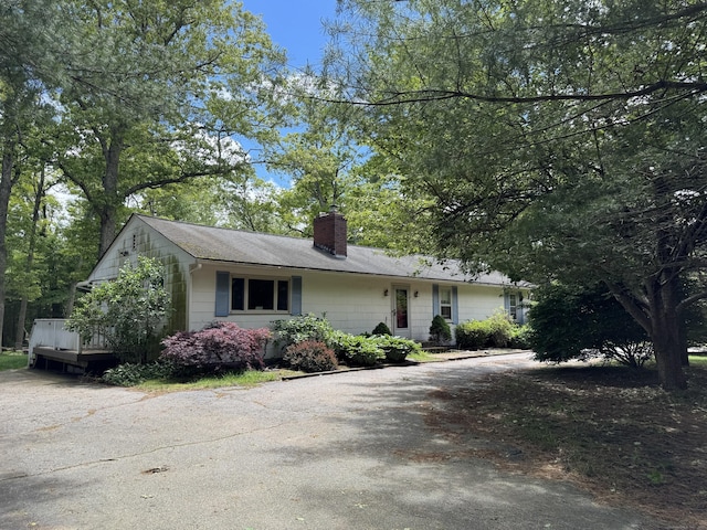 492 Providence New London Tpke, North Stonington, CT 06359 - single story home with a chimney, driveway, and a shingled roof