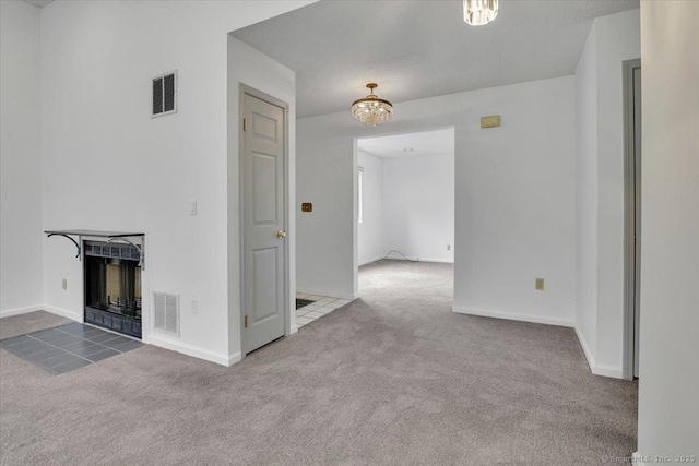 547 Pilgrim Hbr Unit 547, Wallingford, CT 06492 - unfurnished living room featuring carpet floors, a tile fireplace, baseboards, and a chandelier