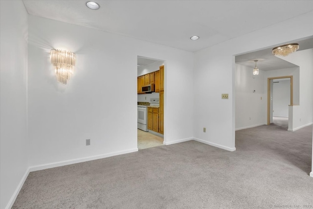 547 Pilgrim Hbr Unit 547, Wallingford, CT 06492 - unfurnished living room with light carpet, baseboards, and recessed lighting
