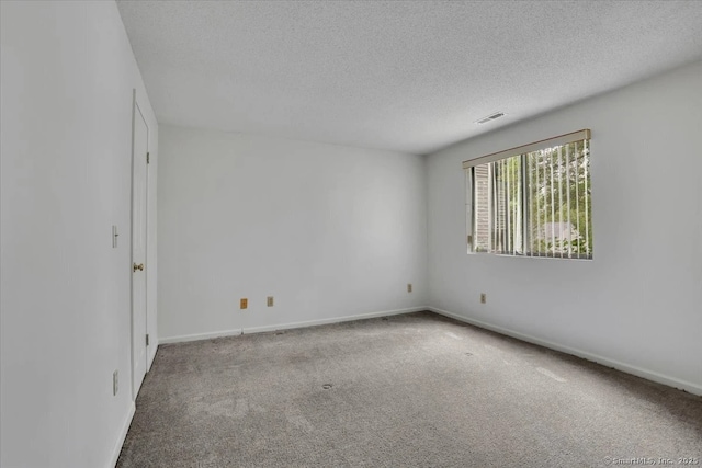 547 Pilgrim Hbr Unit 547, Wallingford, CT 06492 - carpeted spare room featuring a textured ceiling and baseboards