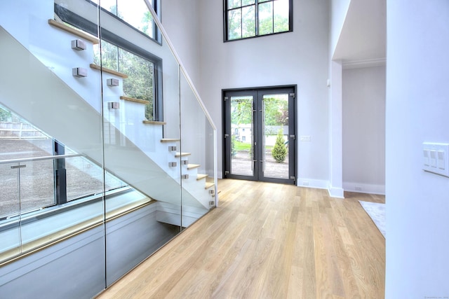158 Compo Rd N, Westport, CT 06880 - entrance foyer featuring plenty of natural light, a towering ceiling, wood finished floors, and baseboards