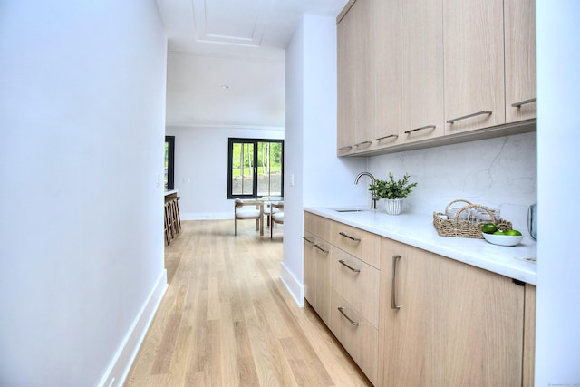 158 Compo Rd N, Westport, CT 06880 - hallway with a sink, light wood-style flooring, and baseboards