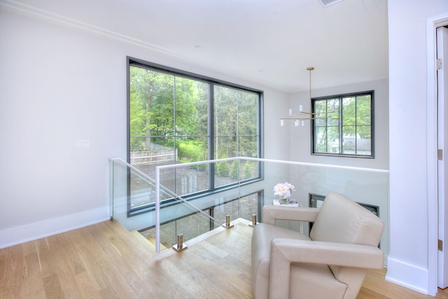 158 Compo Rd N, Westport, CT 06880 - sitting room featuring wood finished floors, plenty of natural light, baseboards, and an upstairs landing