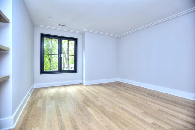 158 Compo Rd N, Westport, CT 06880 - spare room featuring light wood-type flooring, baseboards, and ornamental molding