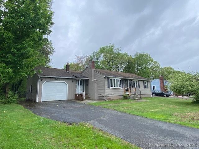 147 Chester St, East Hartford, CT 06108 - single story home featuring an attached garage, driveway, a front yard, and a chimney