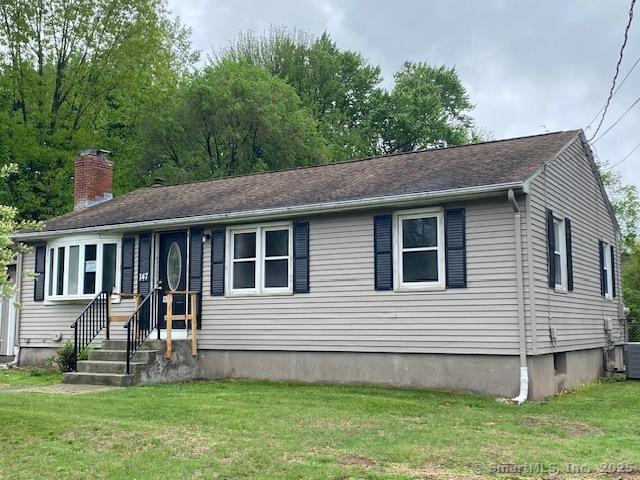 147 Chester St, East Hartford, CT 06108 - view of front of house featuring a chimney, a front yard, and cooling unit