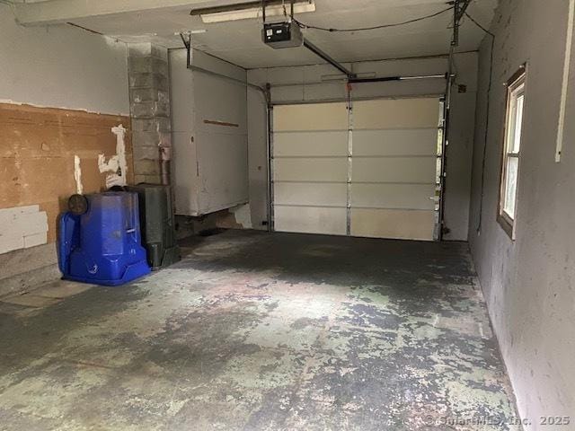 147 Chester St, East Hartford, CT 06108 - garage featuring a garage door opener