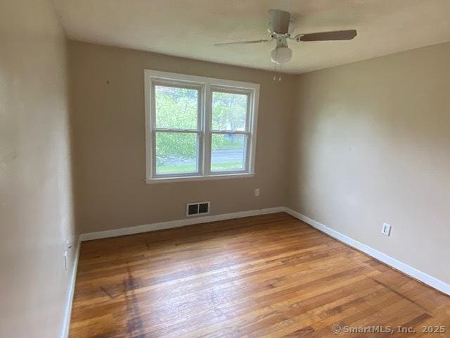 147 Chester St, East Hartford, CT 06108 - unfurnished room with wood finished floors, baseboards, and ceiling fan