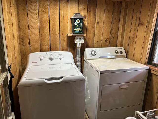 2060 Perkins St, Bristol, CT 06010 - laundry room with washing machine and clothes dryer and wood walls