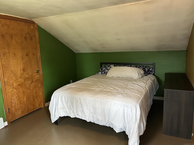 2060 Perkins St, Bristol, CT 06010 - bedroom with lofted ceiling, baseboards, and finished concrete flooring
