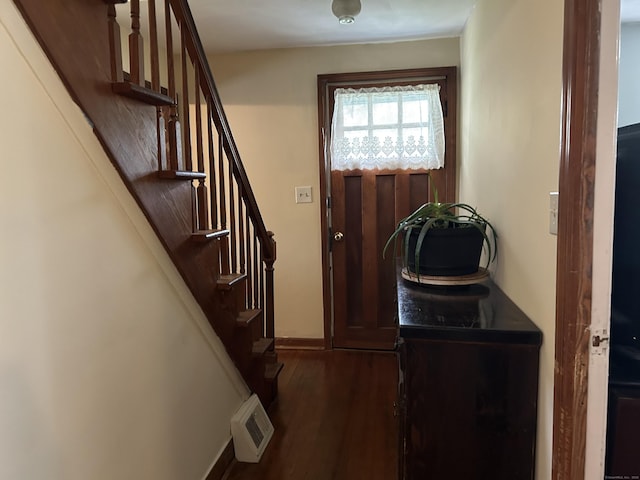 2060 Perkins St, Bristol, CT 06010 - doorway to outside with dark wood-type flooring, stairway, and baseboards