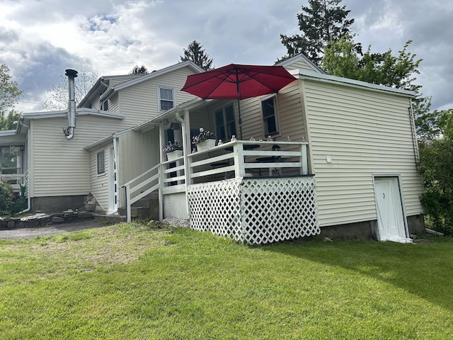 2060 Perkins St, Bristol, CT 06010 - rear view of property featuring a lawn