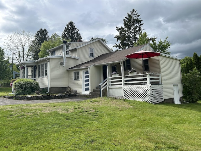 2060 Perkins St, Bristol, CT 06010 - back of house with a lawn and covered porch
