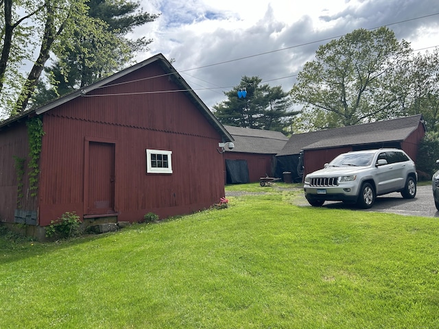 2060 Perkins St, Bristol, CT 06010 - view of side of property with a lawn and driveway