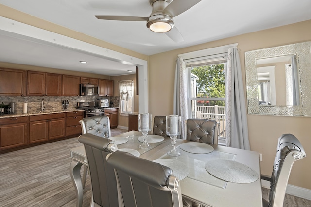 24 High St, West Haven, CT 06516 - dining space with a ceiling fan, baseboards, and light wood finished floors