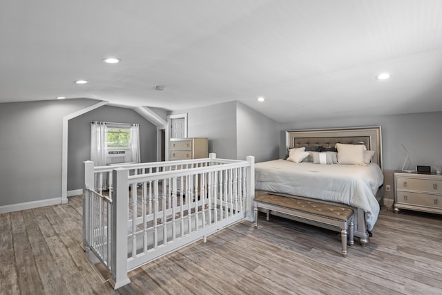 24 High St, West Haven, CT 06516 - bedroom with wood finished floors, vaulted ceiling, recessed lighting, baseboards, and cooling unit