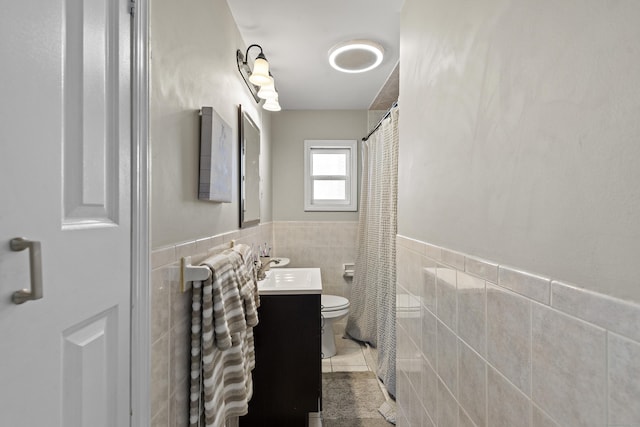 24 High St, West Haven, CT 06516 - full bathroom with tile walls, toilet, vanity, wainscoting, and curtained shower