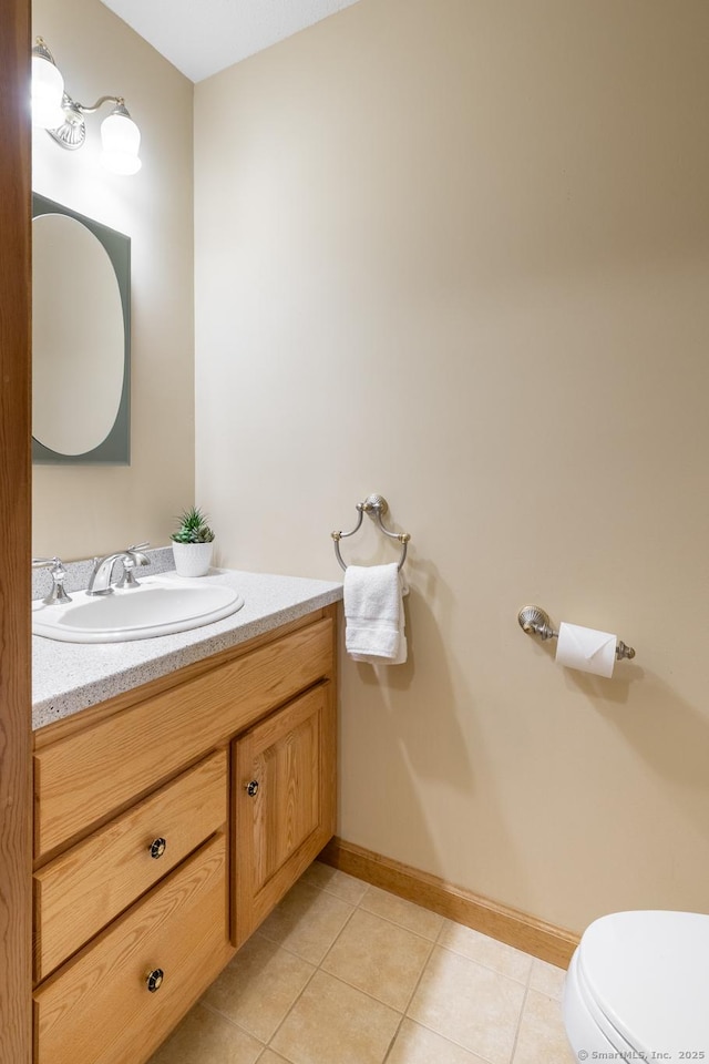 67 Blue Heron Dr, East Hampton, CT 06424 - half bathroom featuring vanity, tile patterned flooring, toilet, and baseboards