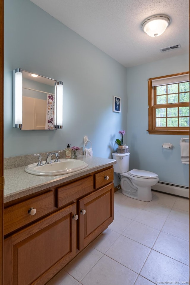 67 Blue Heron Dr, East Hampton, CT 06424 - full bath featuring baseboard heating, toilet, tile patterned flooring, vanity, and a shower with curtain