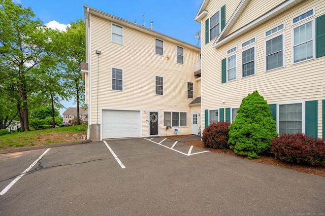 8 Pasco Dr Unit E, East Windsor, CT 06088 - view of front facade featuring driveway and an attached garage