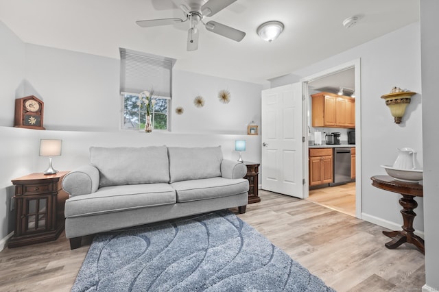 8 Pasco Dr Unit E, East Windsor, CT 06088 - living room with light wood finished floors, a ceiling fan, and baseboards