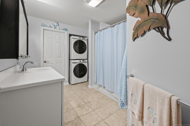 8 Pasco Dr Unit E, East Windsor, CT 06088 - bathroom featuring estacked washer and dryer, tile patterned floors, vanity, and a shower with curtain
